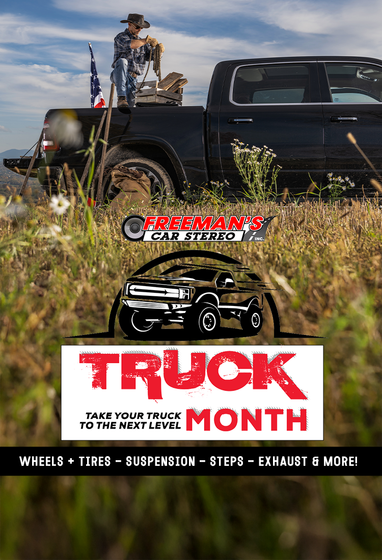 Man With Cowboy hat in his truck in a field. Truck Month: Take Your Truck To The Next Level. Wheels + Tires, Suspension, Steps, Exhaust, and More